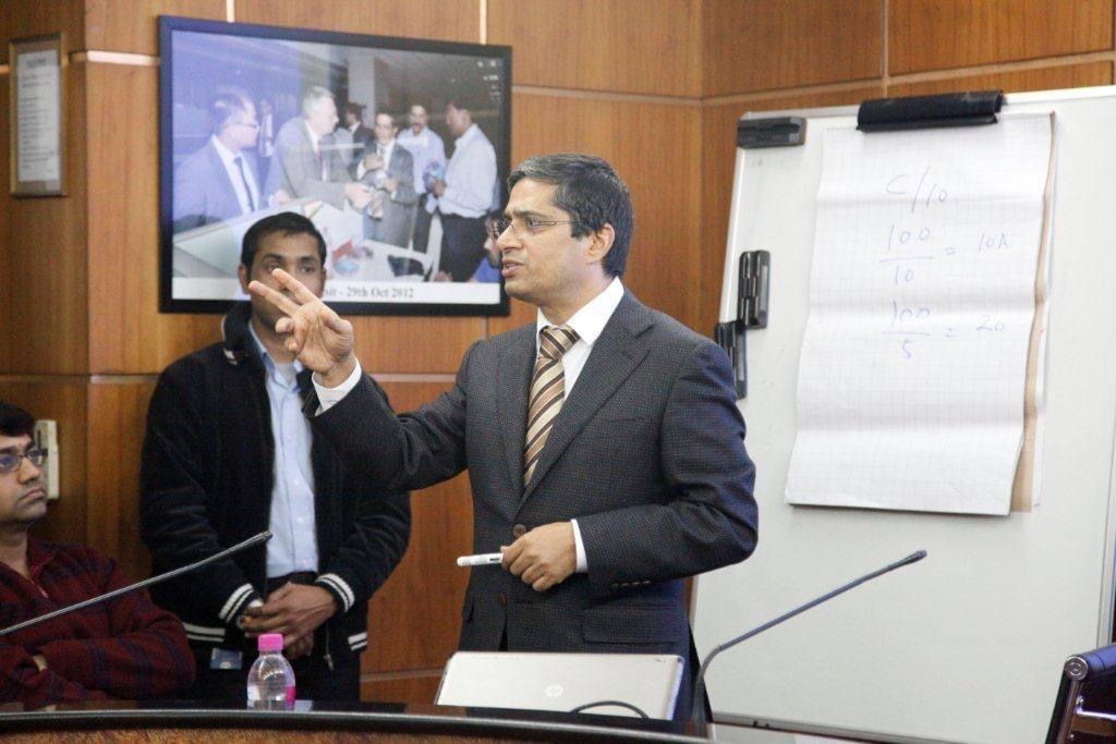 Kunwer Sachdev speaking at an industry event about solar energy innovation